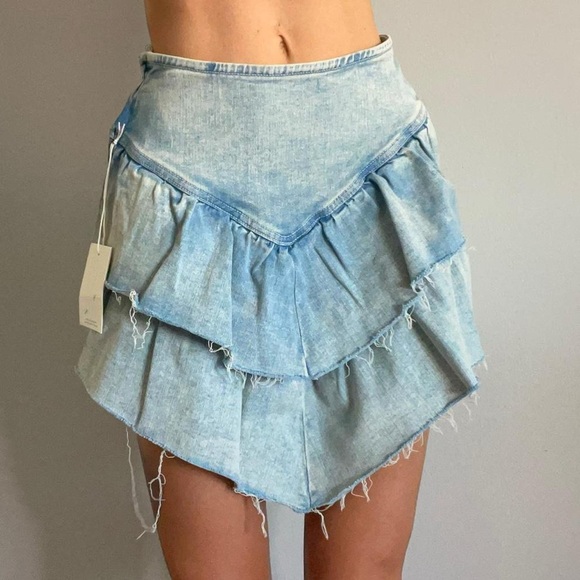MOTHER Light Blue Denim action shot 25” ruffle Skirt
